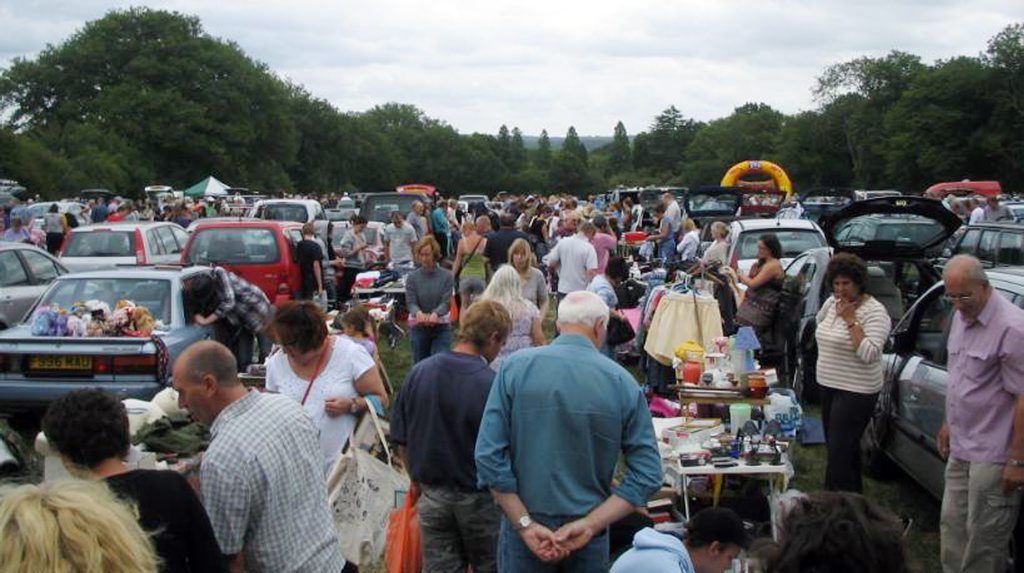 Shoppers and browsers pack into a car boot market.